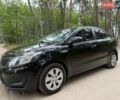 Чорний Кіа Ріо, об'ємом двигуна 1.4 л та пробігом 193 тис. км за 6300 $, фото 1 на Automoto.ua