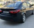 Чорний Кіа Ріо, об'ємом двигуна 1.4 л та пробігом 201 тис. км за 6948 $, фото 4 на Automoto.ua