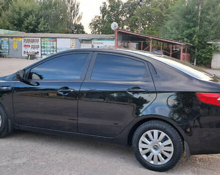 Чорний Кіа Ріо, об'ємом двигуна 1.4 л та пробігом 89 тис. км за 6800 $, фото 1 на Automoto.ua
