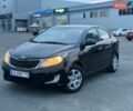 Чорний Кіа Ріо, об'ємом двигуна 1.4 л та пробігом 201 тис. км за 6950 $, фото 1 на Automoto.ua
