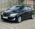 Чорний Кіа Ріо, об'ємом двигуна 1.4 л та пробігом 155 тис. км за 7500 $, фото 1 на Automoto.ua