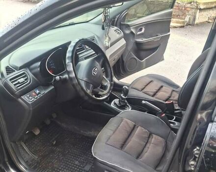 Черный Киа Рио, объемом двигателя 1.4 л и пробегом 197 тыс. км за 7000 $, фото 3 на Automoto.ua