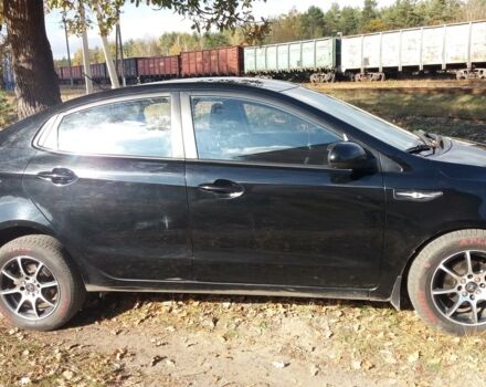 Чорний Кіа Ріо, об'ємом двигуна 1.4 л та пробігом 77 тис. км за 9200 $, фото 3 на Automoto.ua