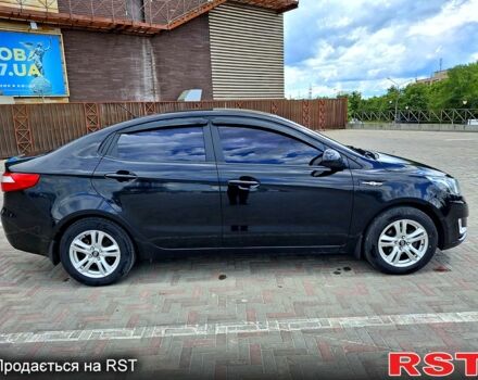 Чорний Кіа Ріо, об'ємом двигуна 14 л та пробігом 96 тис. км за 8600 $, фото 3 на Automoto.ua