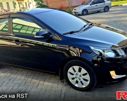 Киа Рио 2013 в Ромнах на Automoto.ua Черный Киа Рио, объемом двигателя 1.6 л и пробегом 130 тыс. км за 8750 $, фото 4 на Automoto.ua