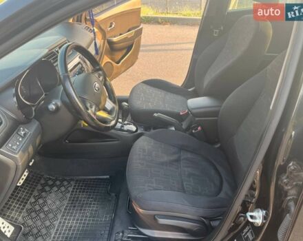 Чорний Кіа Ріо, об'ємом двигуна 1.6 л та пробігом 155 тис. км за 8500 $, фото 4 на Automoto.ua