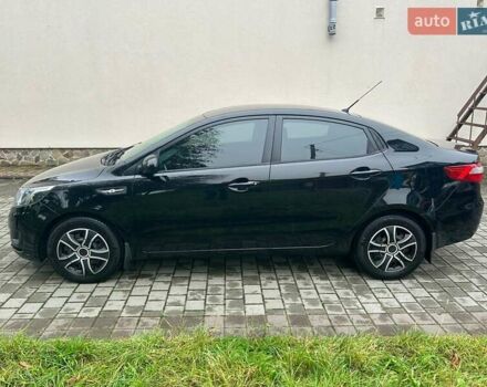 Чорний Кіа Ріо, об'ємом двигуна 1.4 л та пробігом 141 тис. км за 7200 $, фото 4 на Automoto.ua