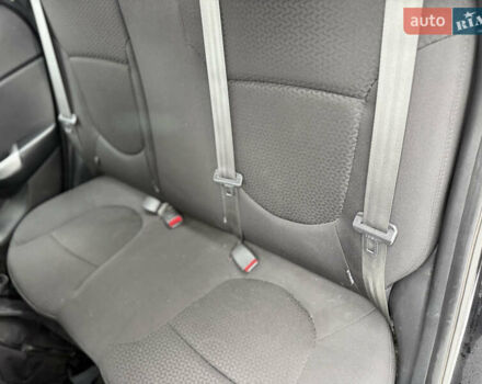 Чорний Кіа Ріо, об'ємом двигуна 1.4 л та пробігом 123 тис. км за 7300 $, фото 12 на Automoto.ua