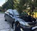 Чорний Кіа Ріо, об'ємом двигуна 1.4 л та пробігом 179 тис. км за 8000 $, фото 1 на Automoto.ua