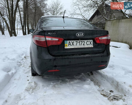 Чорний Кіа Ріо, об'ємом двигуна 1.4 л та пробігом 123 тис. км за 7300 $, фото 2 на Automoto.ua