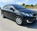 Черный Киа Рио, объемом двигателя 1.6 л и пробегом 142 тыс. км за 6412 $, фото 1 на Automoto.ua