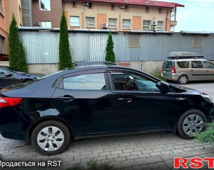 Чорний Кіа Ріо, об'ємом двигуна 1.4 л та пробігом 87 тис. км за 7700 $, фото 5 на Automoto.ua