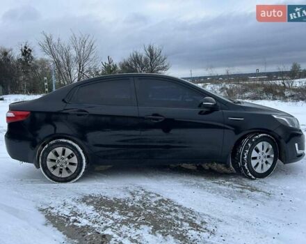 Черный Киа Рио, объемом двигателя 1.59 л и пробегом 107 тыс. км за 7950 $, фото 1 на Automoto.ua