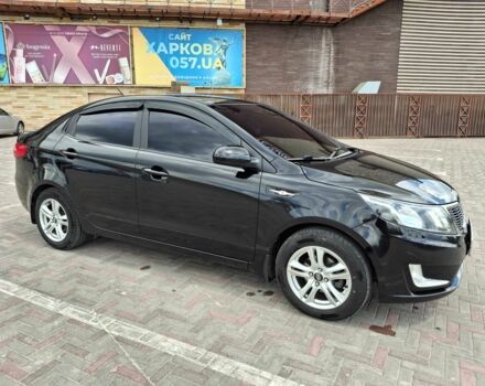 Черный Киа Рио, объемом двигателя 1.4 л и пробегом 96 тыс. км за 9200 $, фото 2 на Automoto.ua