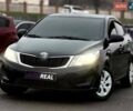 Черный Киа Рио, объемом двигателя 1.4 л и пробегом 220 тыс. км за 8200 $, фото 1 на Automoto.ua