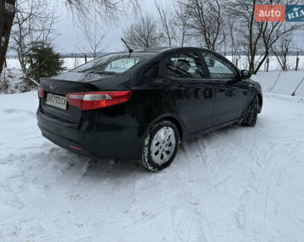 Чорний Кіа Ріо, об'ємом двигуна 1.4 л та пробігом 123 тис. км за 7300 $, фото 3 на Automoto.ua