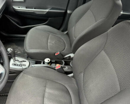 Чорний Кіа Ріо, об'ємом двигуна 1.4 л та пробігом 123 тис. км за 7300 $, фото 24 на Automoto.ua