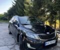 Черный Киа Рио, объемом двигателя 1.4 л и пробегом 179 тыс. км за 7998 $, фото 1 на Automoto.ua