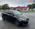 Чорний Кіа Ріо, об'ємом двигуна 1.4 л та пробігом 107 тис. км за 7500 $, фото 1 на Automoto.ua