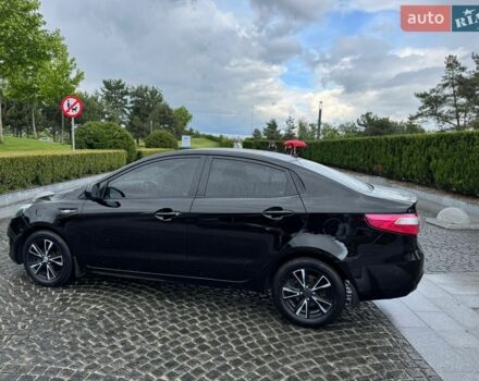Чорний Кіа Ріо, об'ємом двигуна 1.4 л та пробігом 107 тис. км за 7500 $, фото 1 на Automoto.ua