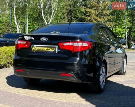 Чорний Кіа Ріо, об'ємом двигуна 1.4 л та пробігом 215 тис. км за 6999 $, фото 6 на Automoto.ua