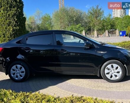 Чорний Кіа Ріо, об'ємом двигуна 1.4 л та пробігом 215 тис. км за 6999 $, фото 7 на Automoto.ua