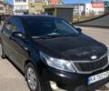 Чорний Кіа Ріо, об'ємом двигуна 1.4 л та пробігом 177 тис. км за 6800 $, фото 1 на Automoto.ua