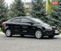 Чорний Кіа Ріо, об'ємом двигуна 1.4 л та пробігом 84 тис. км за 7800 $, фото 1 на Automoto.ua