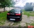 Чорний Кіа Ріо, об'ємом двигуна 1.4 л та пробігом 179 тис. км за 6100 $, фото 3 на Automoto.ua