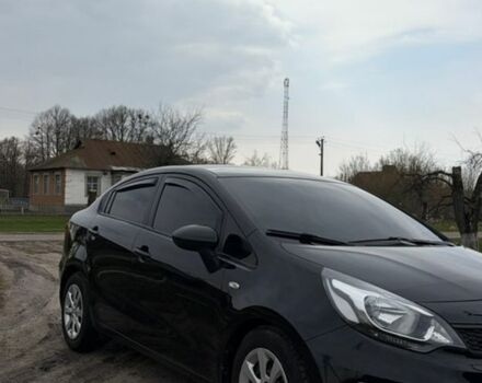 Черный Киа Рио, объемом двигателя 1.25 л и пробегом 100 тыс. км за 7500 $, фото 1 на Automoto.ua