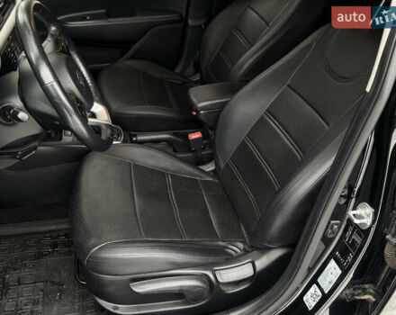 Чорний Кіа Ріо, об'ємом двигуна 1.4 л та пробігом 66 тис. км за 14200 $, фото 8 на Automoto.ua