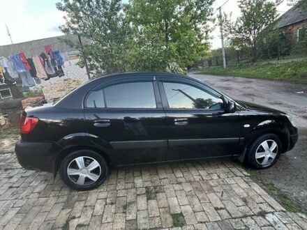 Чорний Кіа Ріо, об'ємом двигуна 1.4 л та пробігом 249 тис. км за 3500 $, фото 1 на Automoto.ua