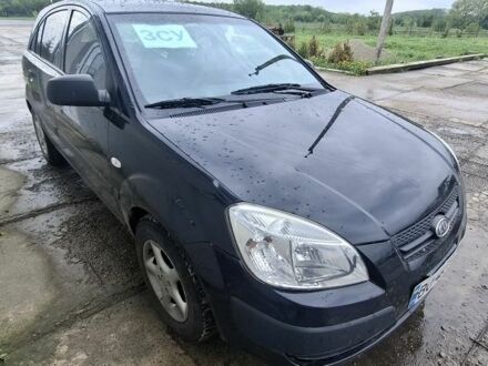 Чорний Кіа Ріо, об'ємом двигуна 2 л та пробігом 253 тис. км за 3534 $, фото 1 на Automoto.ua