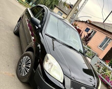 Черный Киа Рио, объемом двигателя 1.4 л и пробегом 252 тыс. км за 3889 $, фото 1 на Automoto.ua