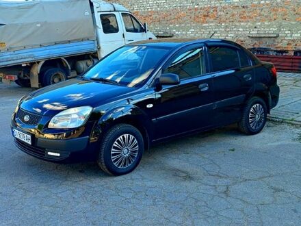 Чорний Кіа Ріо, об'ємом двигуна 1.4 л та пробігом 260 тис. км за 3100 $, фото 1 на Automoto.ua