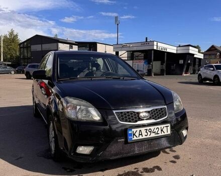 Черный Киа Рио, объемом двигателя 1.4 л и пробегом 245 тыс. км за 4650 $, фото 1 на Automoto.ua