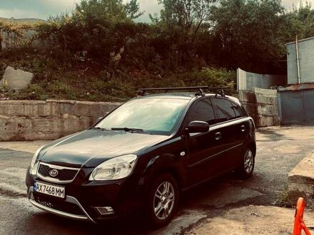 Черный Киа Рио, объемом двигателя 1.4 л и пробегом 243 тыс. км за 5000 $, фото 1 на Automoto.ua