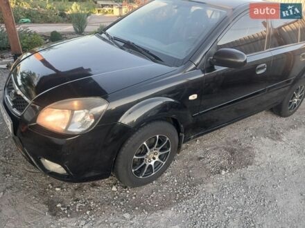 Чорний Кіа Ріо, об'ємом двигуна 1.4 л та пробігом 210 тис. км за 4700 $, фото 1 на Automoto.ua