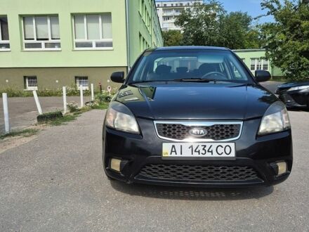 Чорний Кіа Ріо, об'ємом двигуна 1.4 л та пробігом 244 тис. км за 4700 $, фото 1 на Automoto.ua