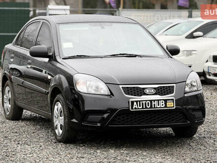 Черный Киа Рио, объемом двигателя 1.4 л и пробегом 100 тыс. км за 5000 $, фото 1 на Automoto.ua