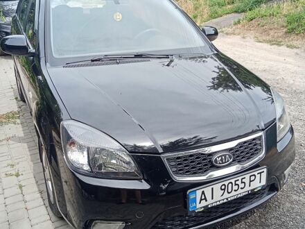 Чорний Кіа Ріо, об'ємом двигуна 1.4 л та пробігом 273 тис. км за 5700 $, фото 1 на Automoto.ua