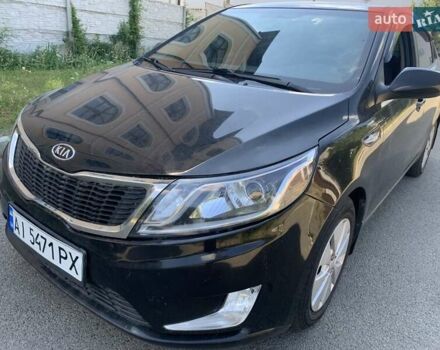 Чорний Кіа Ріо, об'ємом двигуна 1.4 л та пробігом 167 тис. км за 4870 $, фото 1 на Automoto.ua