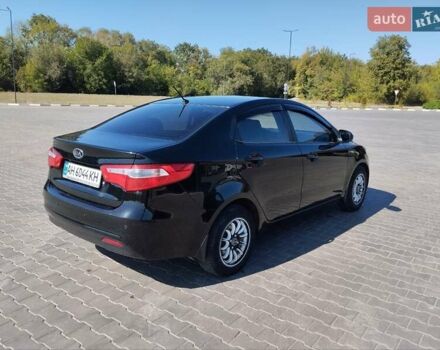 Чорний Кіа Ріо, об'ємом двигуна 1.4 л та пробігом 113 тис. км за 6900 $, фото 1 на Automoto.ua