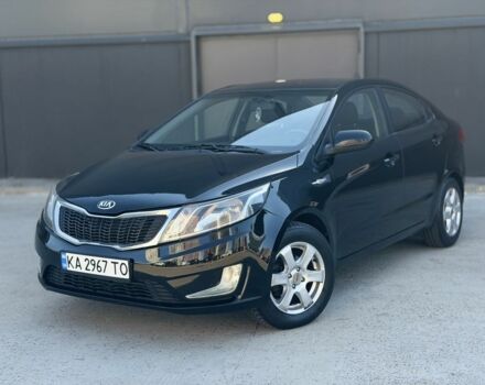 Чорний Кіа Ріо, об'ємом двигуна 1.4 л та пробігом 201 тис. км за 6948 $, фото 1 на Automoto.ua