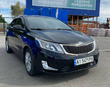 Черный Киа Рио, объемом двигателя 1.4 л и пробегом 100 тыс. км за 5999 $, фото 1 на Automoto.ua