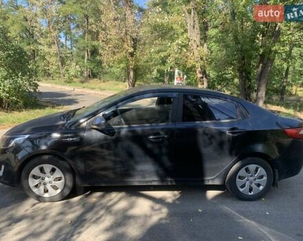 Черный Киа Рио, объемом двигателя 1.4 л и пробегом 146 тыс. км за 5075 $, фото 1 на Automoto.ua
