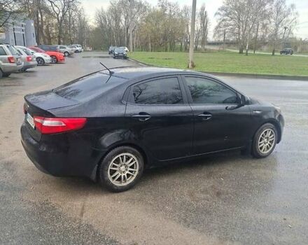 Чорний Кіа Ріо, об'ємом двигуна 1.4 л та пробігом 197 тис. км за 7000 $, фото 1 на Automoto.ua