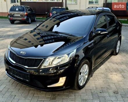 Черный Киа Рио, объемом двигателя 1.6 л и пробегом 130 тыс. км за 8750 $, фото 1 на Automoto.ua
