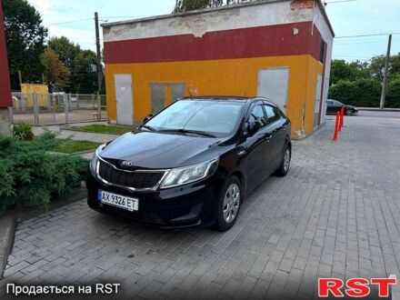 Чорний Кіа Ріо, об'ємом двигуна 1.4 л та пробігом 87 тис. км за 7700 $, фото 1 на Automoto.ua