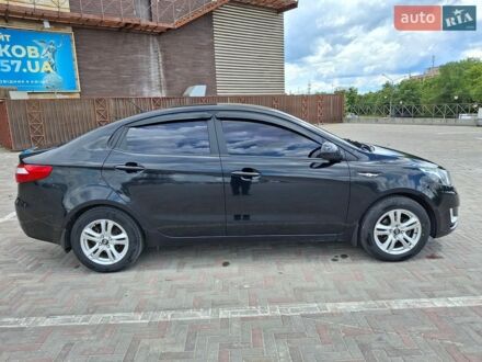 Черный Киа Рио, объемом двигателя 1.4 л и пробегом 96 тыс. км за 9200 $, фото 1 на Automoto.ua